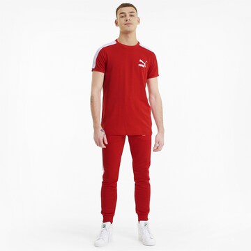 PUMA - Tapered Calças de desporto 'Iconic T7' em vermelho