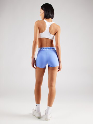 NIKE Skinny Sports trousers in Purple