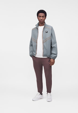 Nike Sportswear - Tapered Calças 'TCH FLC' em azul: frente