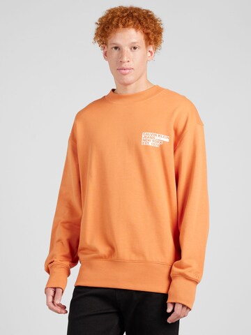 Calvin Klein Jeans Sweatshirt in Oranje: voorkant