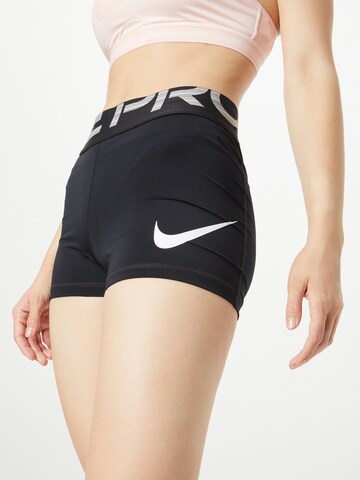 NIKE Skinny Sports trousers in Black