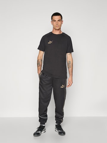Effilé Pantalon de sport 'KING Anthem' PUMA en noir