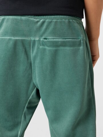 Nike Sportswear Дънки Tapered Leg Панталон в зелено