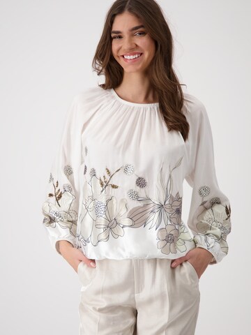 monari Blus i beige: framsida