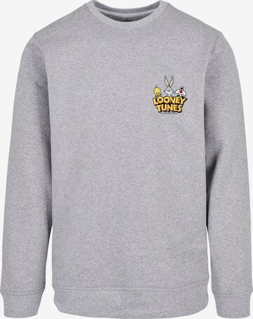 F4NT4STIC Sweatshirt 'Looney Tunes Group Faux Pocket' in Grijs: voorkant