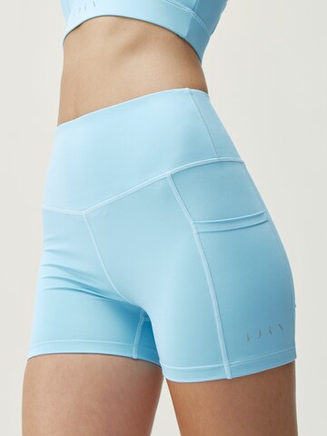 Born Living Yoga Skinny Sportbroek 'Cira' in Blauw: voorkant