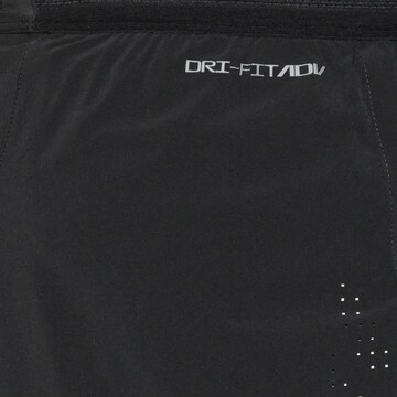 NIKE Regular Workout Pants in Black