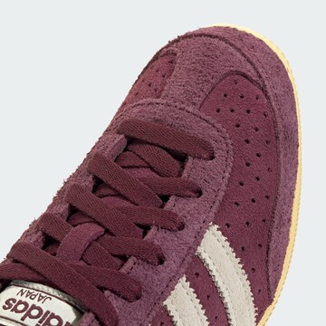Baskets basses ADIDAS ORIGINALS en rouge