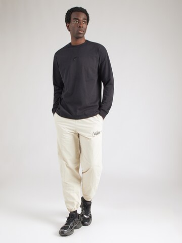 Effilé Pantalon 'CLUB' Nike Sportswear en vert