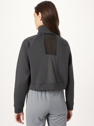 NIKE - Sweatshirt de desporto em cinzento