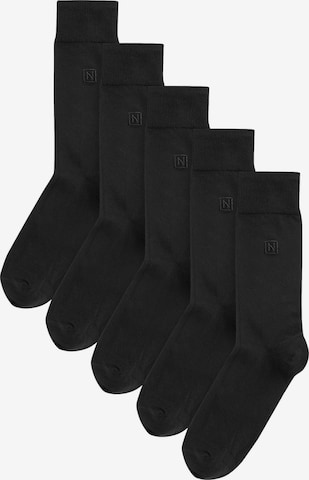 Next Nogavice | črna barva: sprednja stran