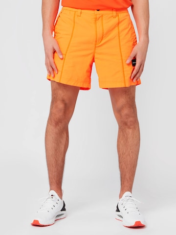 Calvin Klein Jeans Pants in Orange: front