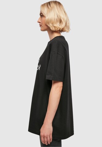 T-shirt oversize 'But First Coffee' Merchcode en noir