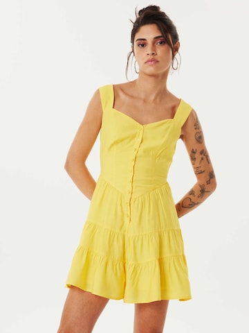 Twist Jumpsuit in Yellow: front