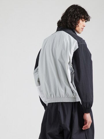 Giacca di mezza stagione 'CLUB' di Nike Sportswear in grigio