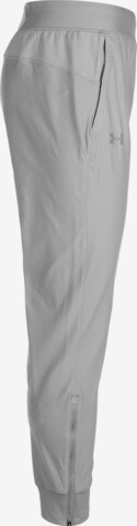 Tapered Pantaloni sportivi di UNDER ARMOUR in grigio