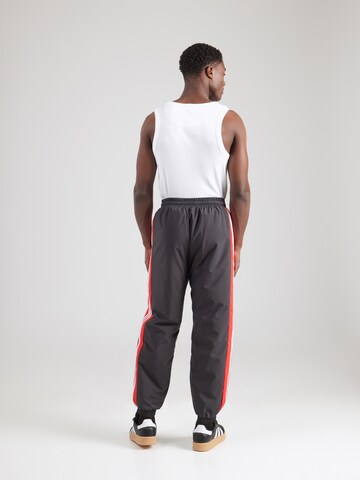 ADIDAS ORIGINALSTapered Hlače 'WARM-UP' - crna boja