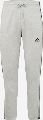Pantalon de sport 'Essentials French Terry Tapered Elastic Cuff 3-Stripes' ADIDAS SPORTSWEAR en gris : devant