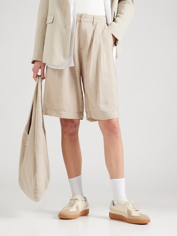 QS Loose fit Pleat-front trousers in Beige: front