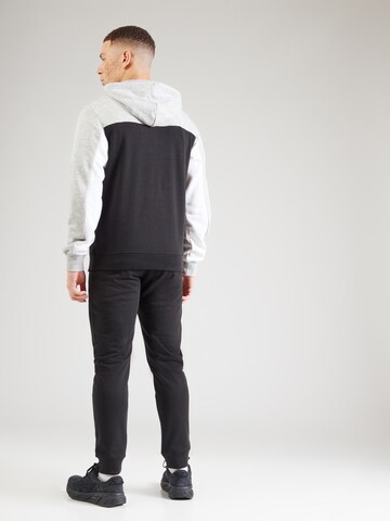 Tuta da jogging di Champion Authentic Athletic Apparel in nero