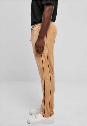 Karl Kani Regular Pants in Beige