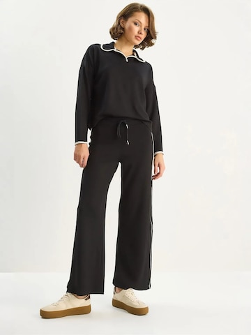 Pantalons de tailleur Bianco Lucci en noir