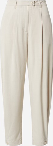 Karo Kauer Tapered Pleat-Front Pants in Beige: front