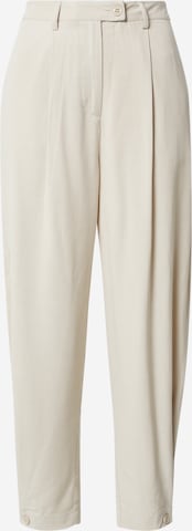 Karo Kauer Tapered Pleat-front trousers in Beige: front