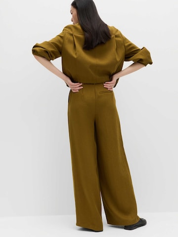 Wide leg Pantaloni con piega frontale di Marks & Spencer in verde