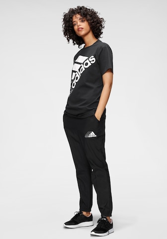 ADIDAS SPORTSWEAR Tapered Urheiluhousut värissä musta