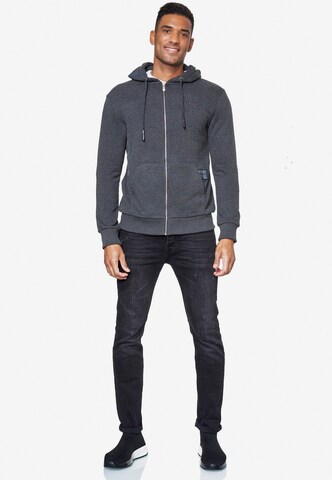 Rusty Neal Zip-Up Hoodie in Grey