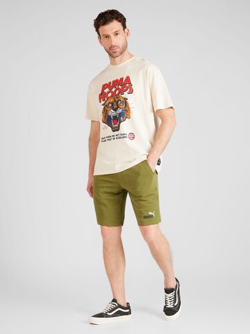 Regular Pantaloni sport 'ESS' de la PUMA pe verde