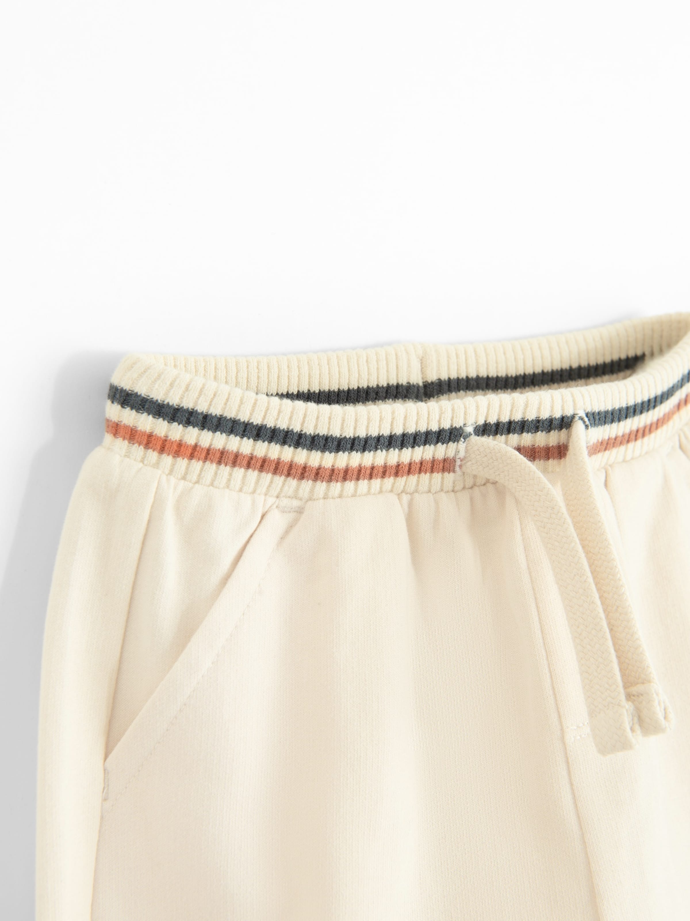 bēšs Cool Club Pakapēniski sašaurināts piegriezums Bikses