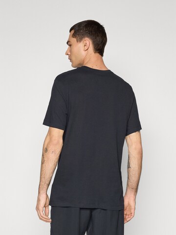 NIKE - Camiseta funcional 'WINNING' en negro