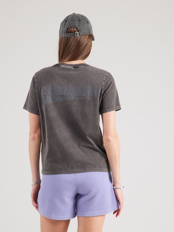 T-shirt Champion en noir : devant
