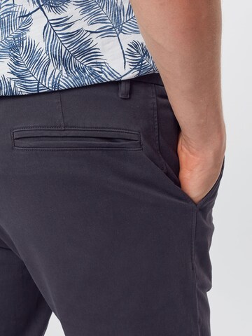 mėlyna ARMEDANGELS Prigludęs Kelnės 'Ato'