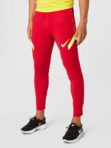 NIKE Slim fit Workout Pants 'Strike' in Red: front