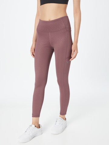 PUMA Skinny Workout Pants in Purple: front