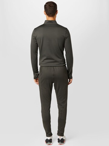 Coupe slim Pantalon de sport UNDER ARMOUR en vert