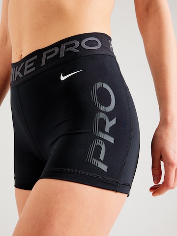 Skinny Pantalon de sport NIKE en noir