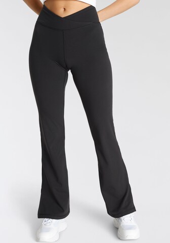 FAYN SPORTS Flared Workout Pants in Black: front