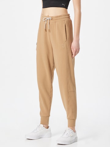 PUMA Tapered Workout Pants 'Infuse' in Beige: front