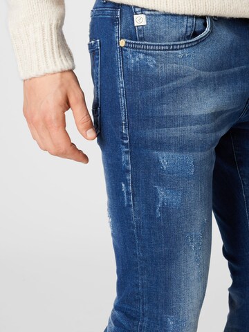 Goldgarn Slimfit Jeans i blå