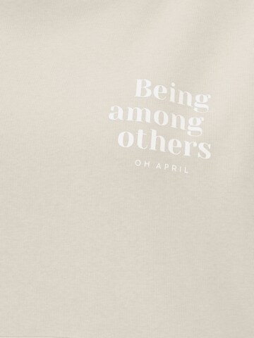 Bluză de molton 'Among Others' de la OH APRIL pe bej