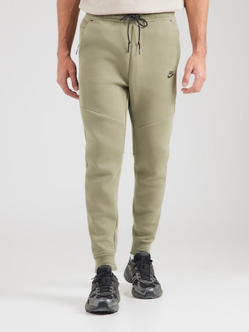 Nike Sportswear Tapered Nadrág 'TCH FLC' - zöld: elől