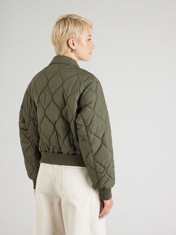 Tommy Jeans Between-Season Jacket 'ONION' in Green
