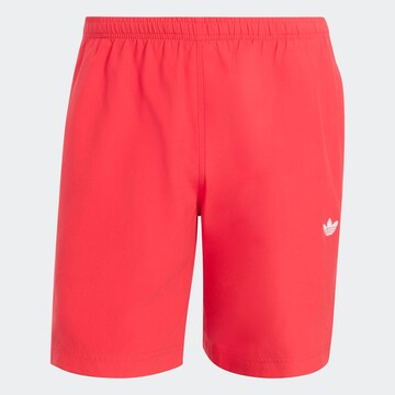 ADIDAS ORIGINALS Regular Pants in Orange: front