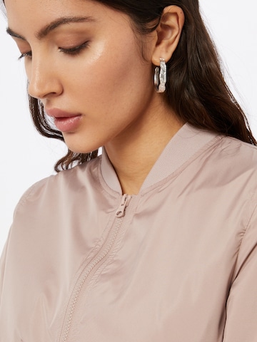 Veste mi-saison Urban Classics en rose