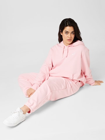 Nike Sportswear Avsmalnet Sportsbukse i rosa