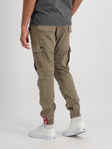 ALPHA INDUSTRIES Tapered Cargo trousers 'Airman' in Green